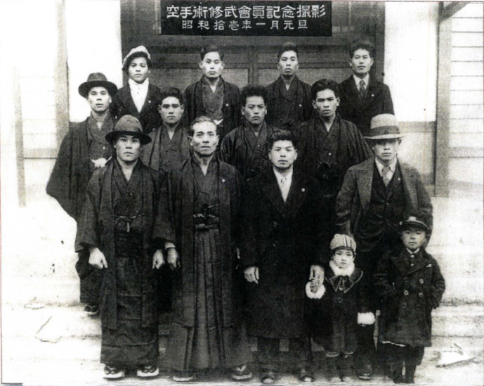 January 1936. Front row (left to right); Kazuo Kishimoto, Kanbun Uechi (59), Ryuyu Tomoyose (39), Kanei Uechi (25). Second row: Hachizo Oshiro, Shuei Sakiyama, Noboru Uchima, Takeo Gibo.